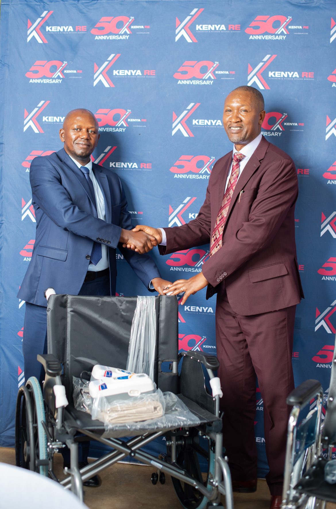 Dr Hillary Maina Wachinga, Group Managing Director of the Kenya Reinsurance Corporation and Dr. Kibet Shikuku, the CEO of the National Spinal Injury Hosp